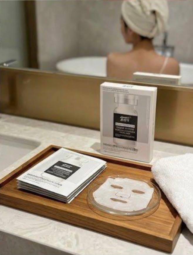 Aonishi masks on a wooden tray beside a bathtub